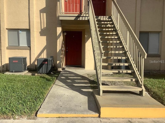 doorway to property featuring central AC