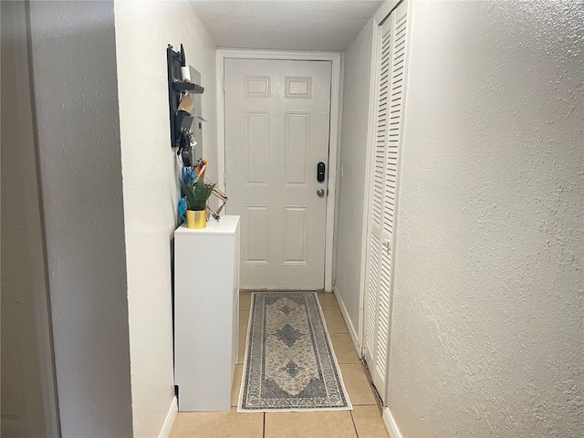 hallway featuring light tile patterned floors