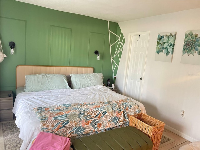 bedroom with tile patterned floors