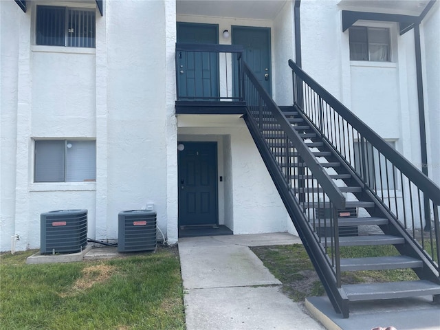 doorway to property with central AC unit