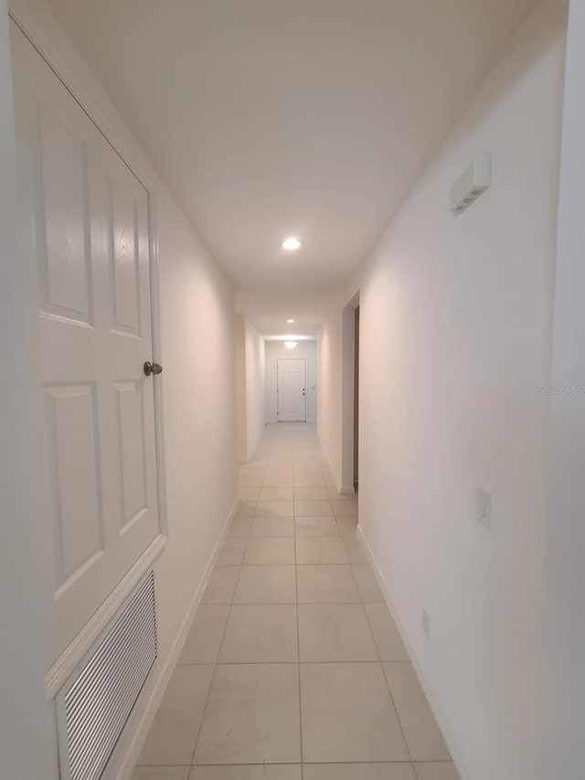 hall with light tile patterned flooring