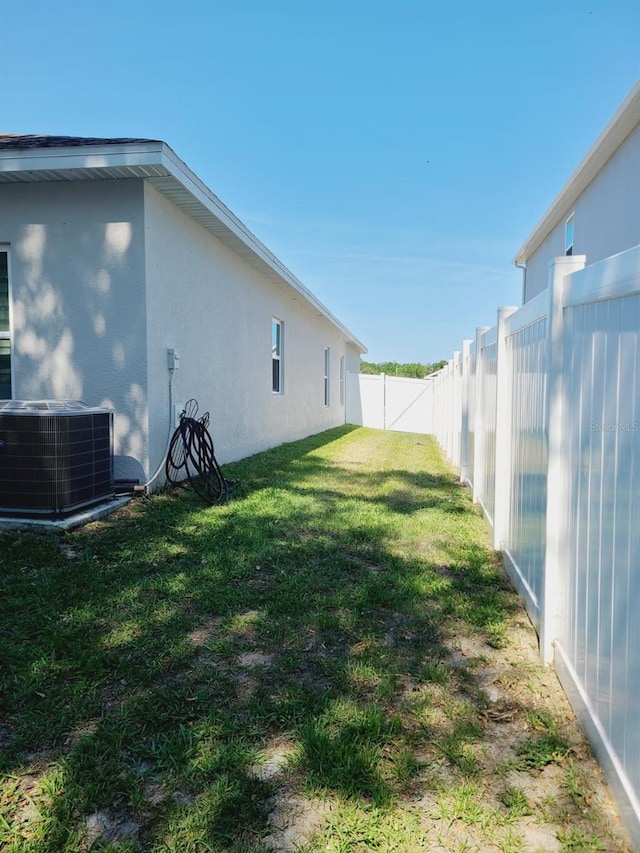 view of yard featuring central AC