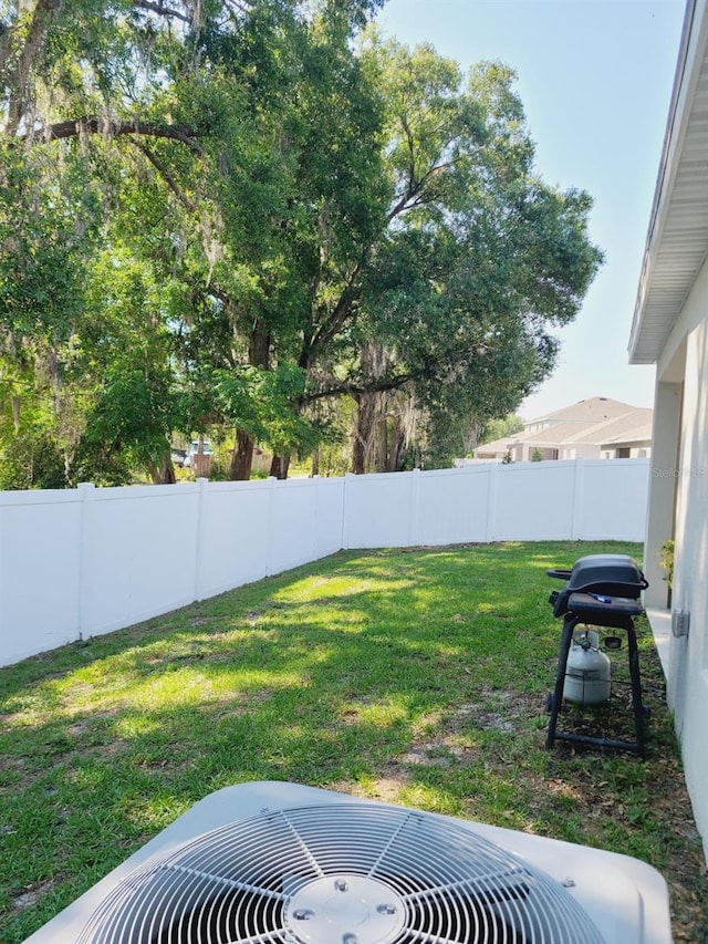 view of yard featuring central AC unit