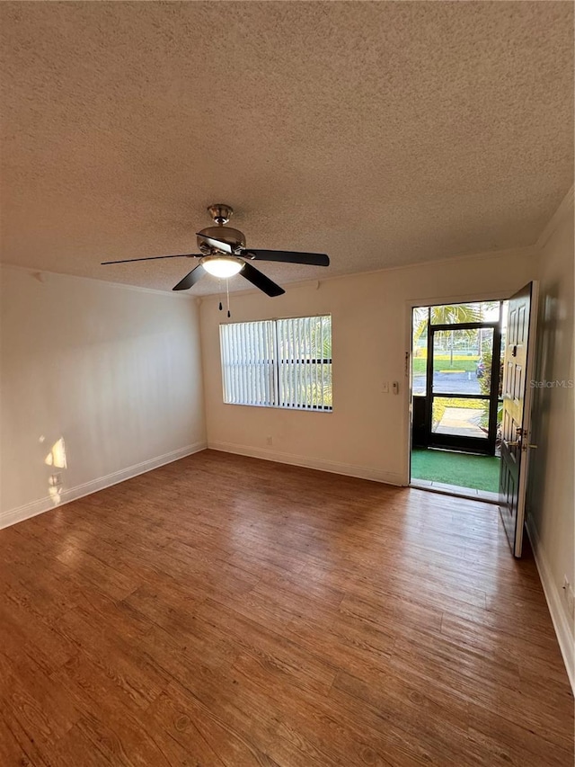 unfurnished room with hardwood / wood-style flooring, a textured ceiling, and ceiling fan