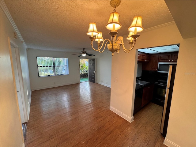 kitchen featuring ceiling fan with notable chandelier, wood-type flooring, hanging light fixtures, crown molding, and a textured ceiling