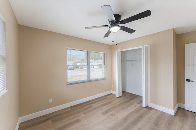 unfurnished bedroom with a closet, ceiling fan, and light wood-type flooring