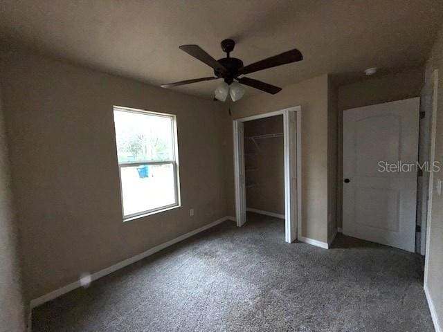 unfurnished bedroom with a closet and ceiling fan