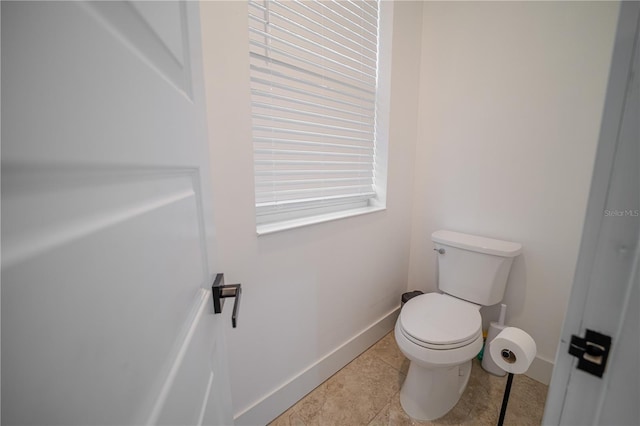 bathroom featuring tile patterned floors and toilet