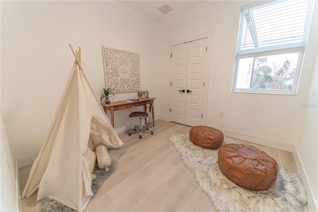 living area with hardwood / wood-style floors