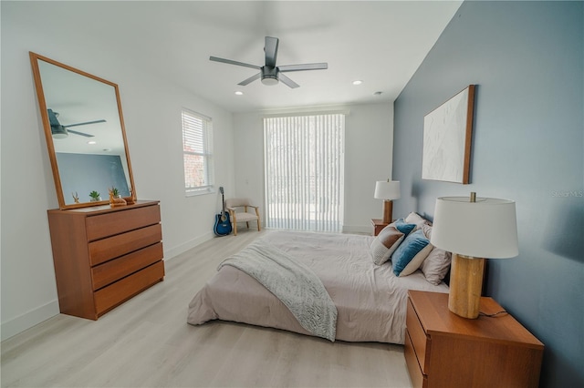 bedroom featuring light hardwood / wood-style floors and ceiling fan