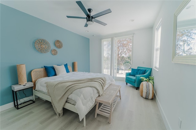 bedroom featuring light hardwood / wood-style floors and ceiling fan