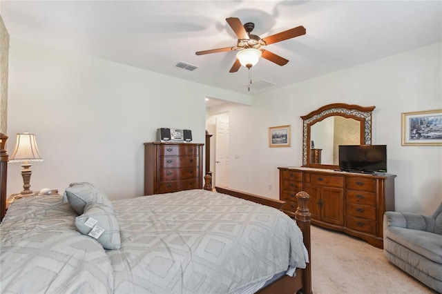 bedroom featuring light colored carpet and ceiling fan