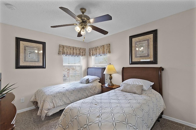 carpeted bedroom with a textured ceiling and ceiling fan