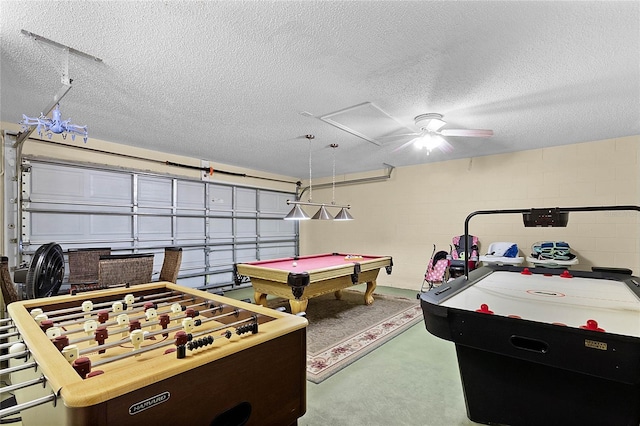 recreation room featuring pool table and a textured ceiling