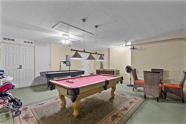 rec room with concrete flooring, billiards, and a textured ceiling