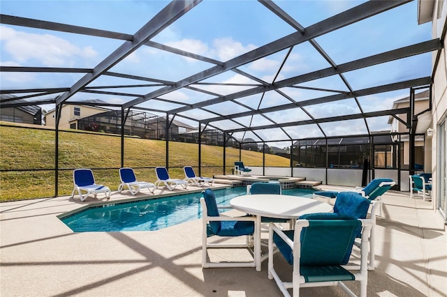 view of swimming pool featuring a yard, a lanai, a patio area, and an in ground hot tub