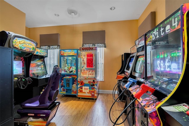 recreation room with light wood-type flooring