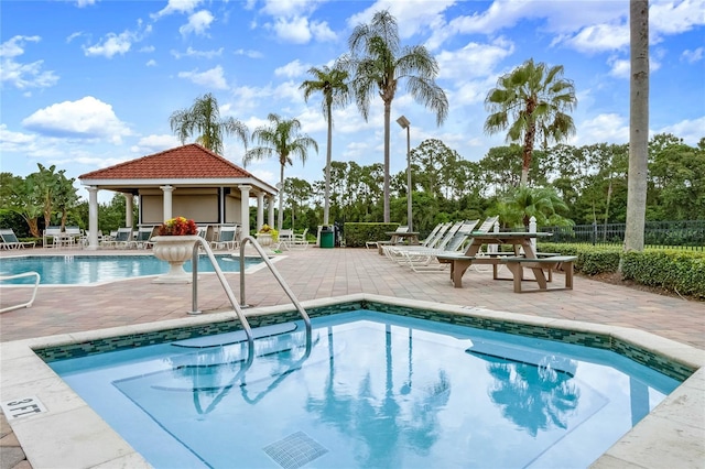 view of pool with a patio and a gazebo