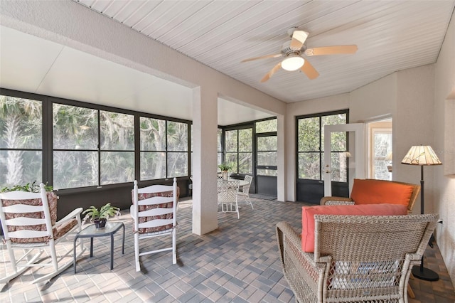 sunroom / solarium with ceiling fan