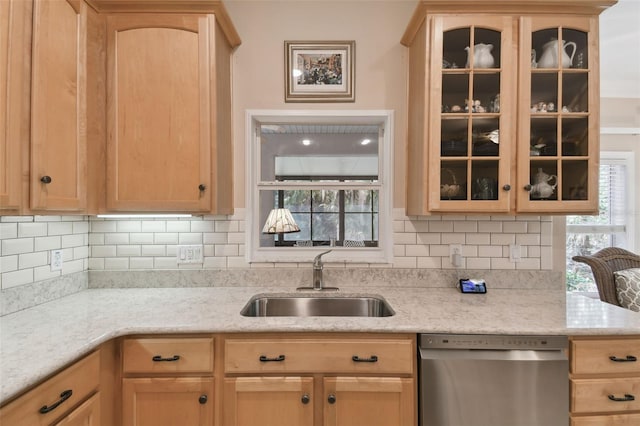 kitchen featuring light brown cabinetry, sink, tasteful backsplash, and stainless steel dishwasher