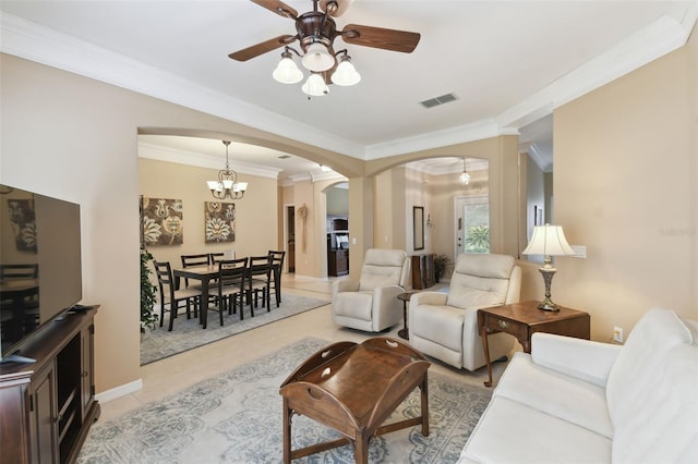 tiled living room with crown molding and ceiling fan with notable chandelier