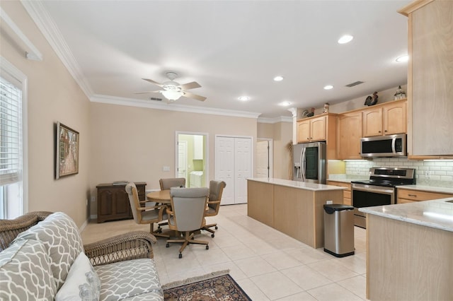 kitchen featuring backsplash, ornamental molding, stainless steel appliances, and light brown cabinets