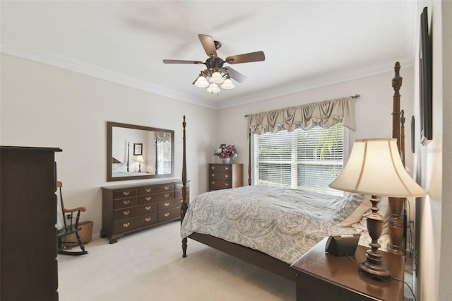 carpeted bedroom featuring ornamental molding and ceiling fan