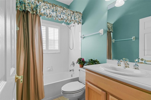 full bathroom featuring shower / bath combination with curtain, vanity, and toilet