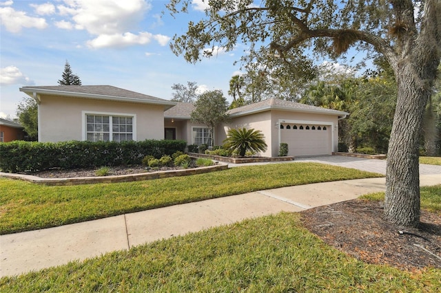 single story home featuring a garage and a front lawn