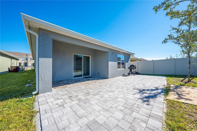 2265 Tay Wes Dr, Saint Cloud, FL 34771 - rear view of property featuring a yard and a patio