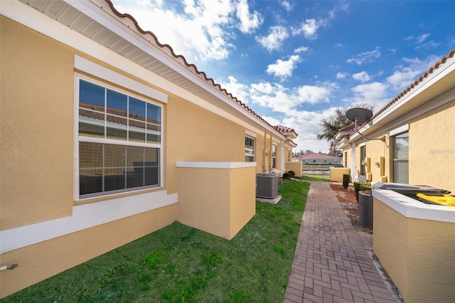 view of property exterior with cooling unit