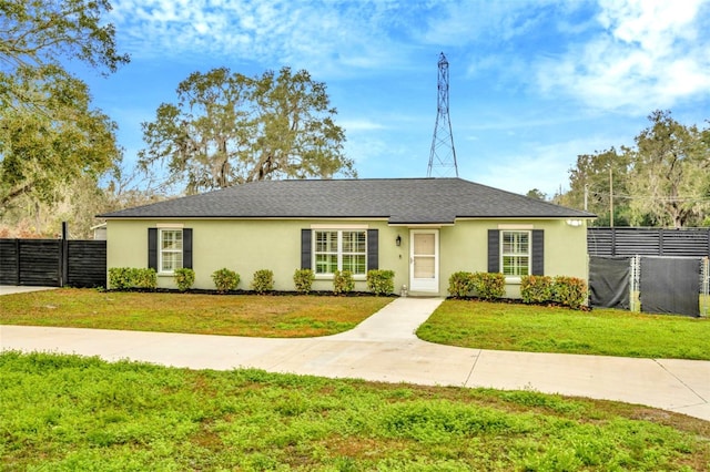 ranch-style home with a front lawn