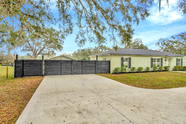 ranch-style house with a front yard