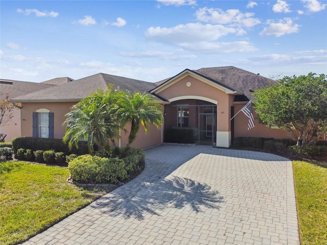 ranch-style home with a front yard