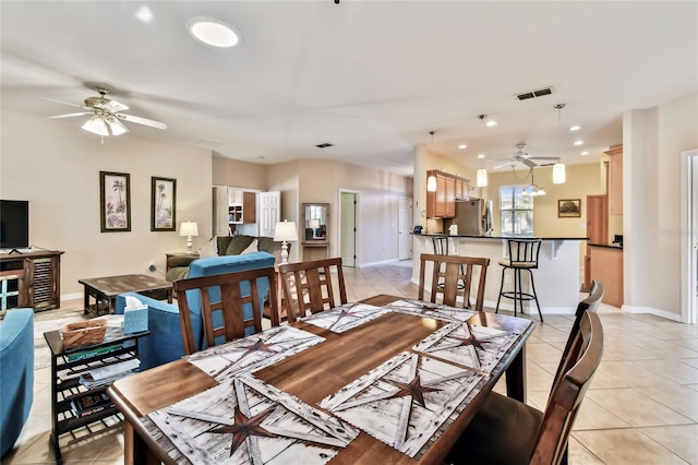 dining room featuring ceiling fan and light tile patterned flooring