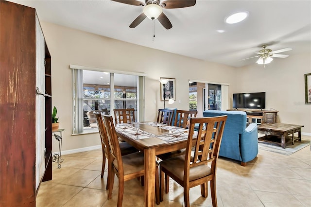 tiled dining room with ceiling fan