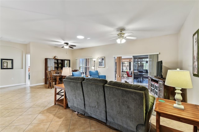 living room featuring tile patterned flooring and ceiling fan