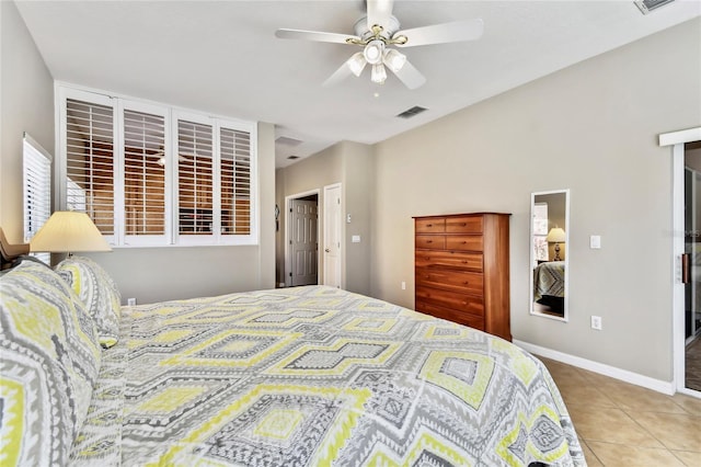 bedroom with tile patterned flooring and ceiling fan