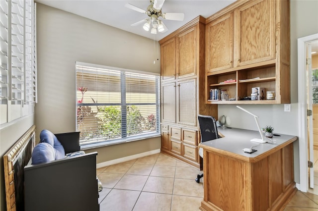 tiled office space with ceiling fan