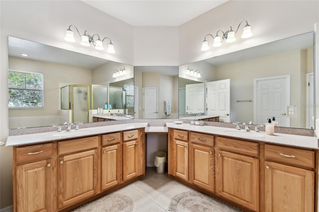 bathroom with tile patterned flooring, vanity, and a shower with shower door