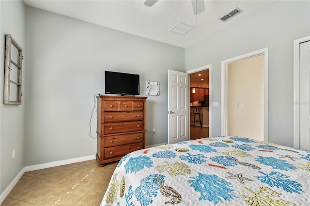 tiled bedroom with ceiling fan