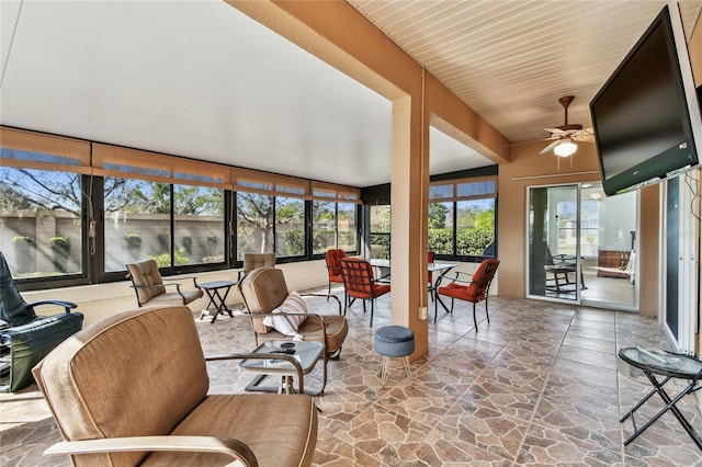 sunroom featuring plenty of natural light and ceiling fan