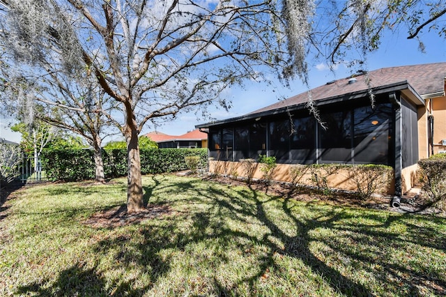 view of yard with a sunroom