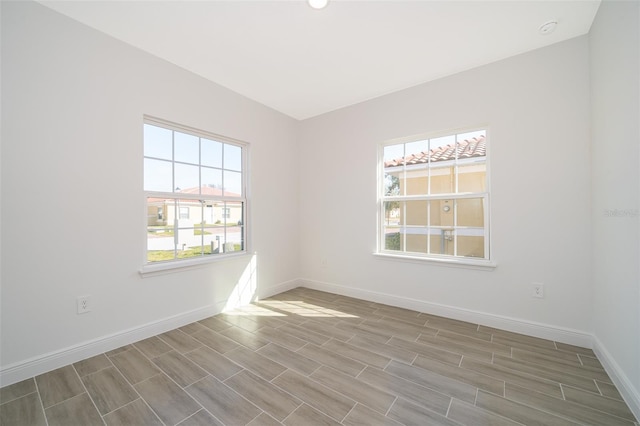 unfurnished room featuring a healthy amount of sunlight