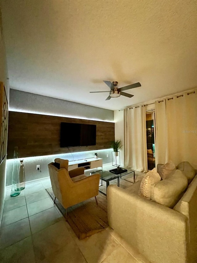3180 Paradox Cir Unit 102, Kissimmee, FL 34746 - tiled living area featuring ceiling fan and wood walls