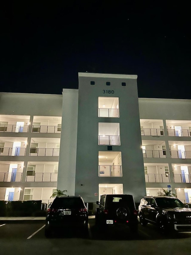 3180 Paradox Cir Unit 102, Kissimmee, FL 34746 - property at night with uncovered parking