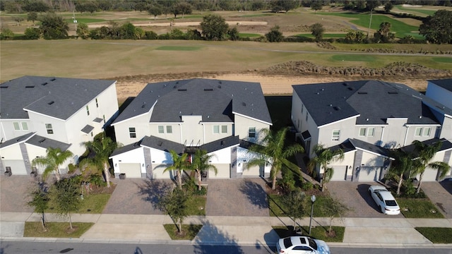 drone / aerial view featuring a residential view and golf course view