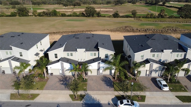 aerial view with golf course view and a residential view