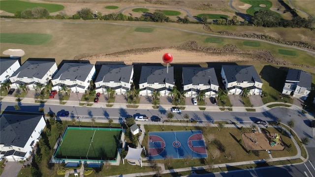 birds eye view of property featuring golf course view and a residential view