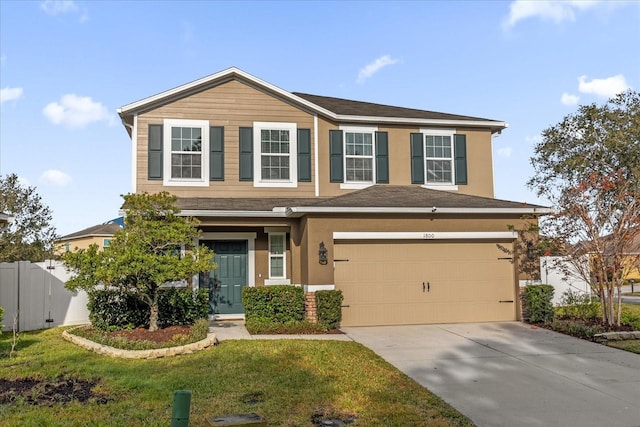 view of front facade with a garage and a front lawn